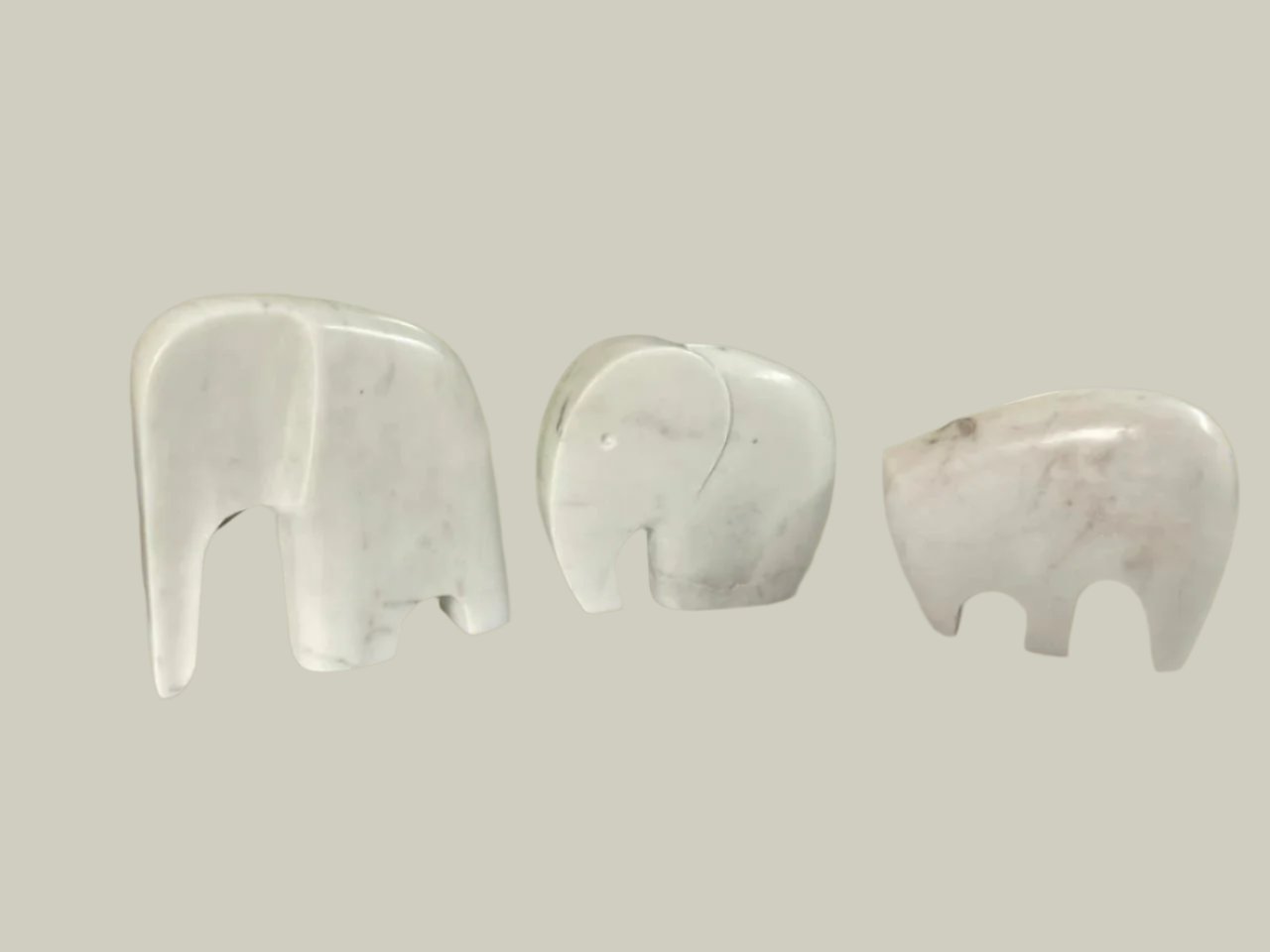 "Trio of Marble Elegance: Elephant, Bear, and Rhino Sculptures"