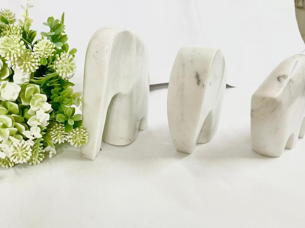 "Trio of Marble Elegance: Elephant, Bear, and Rhino Sculptures"